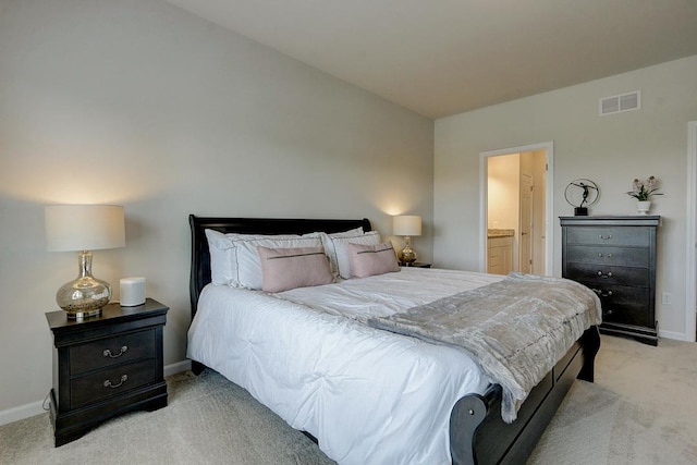 carpeted bedroom with ensuite bathroom