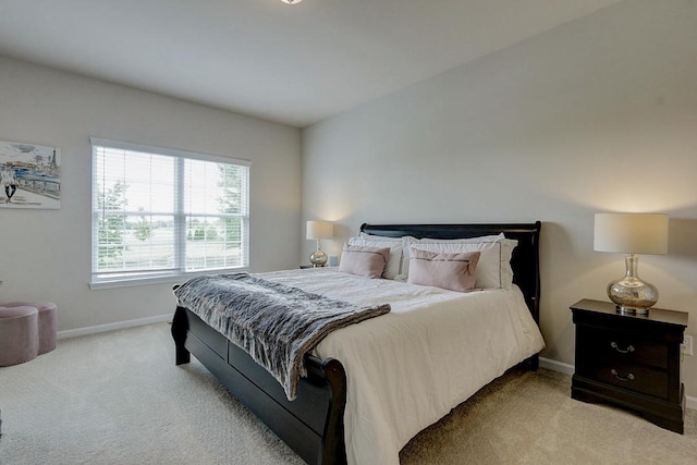 bedroom featuring light colored carpet