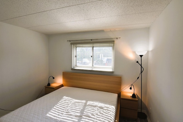 bedroom with a paneled ceiling