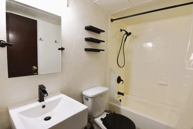 full bathroom with tiled shower / bath, toilet, and sink