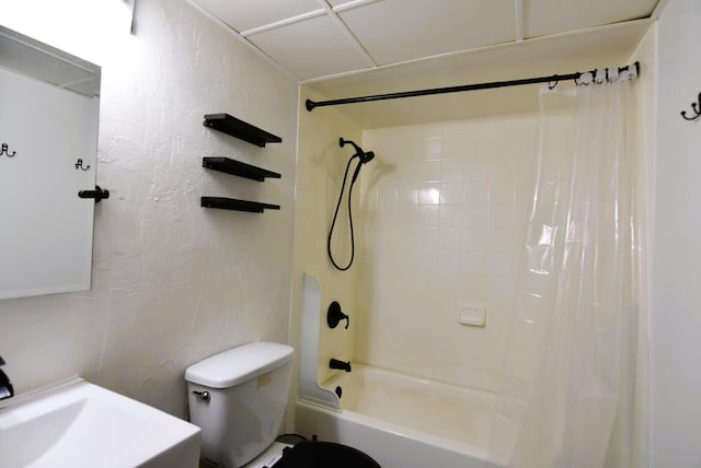 bathroom with toilet and shower / bath combo with shower curtain