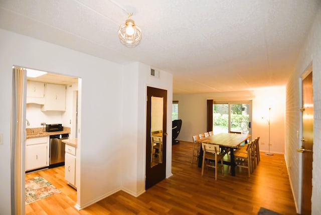 dining room featuring light wood-type flooring