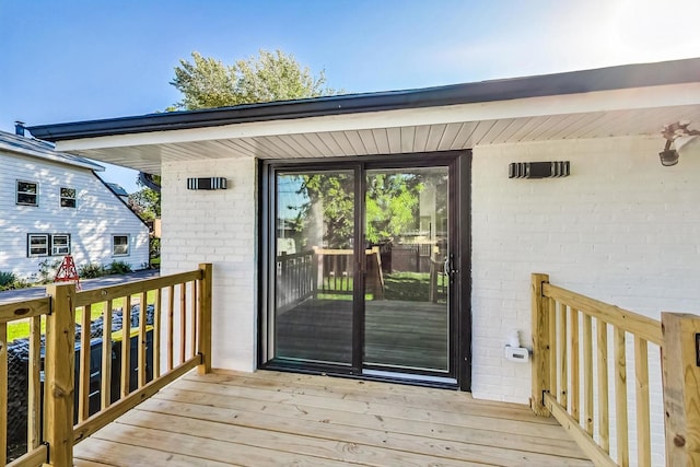 entrance to property with a deck