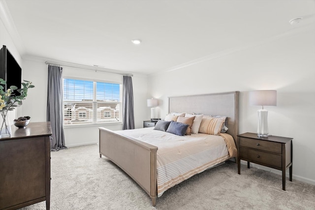 carpeted bedroom featuring crown molding