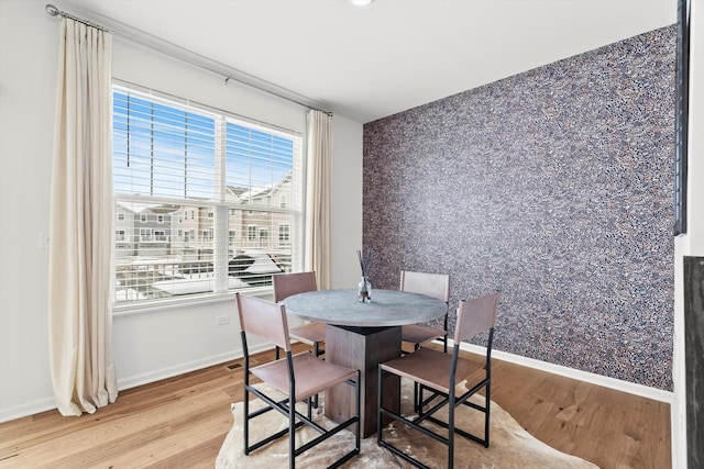 dining room with light hardwood / wood-style floors