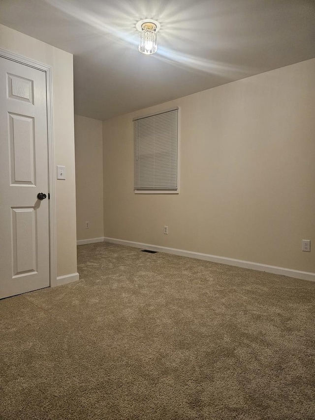 empty room featuring carpet flooring