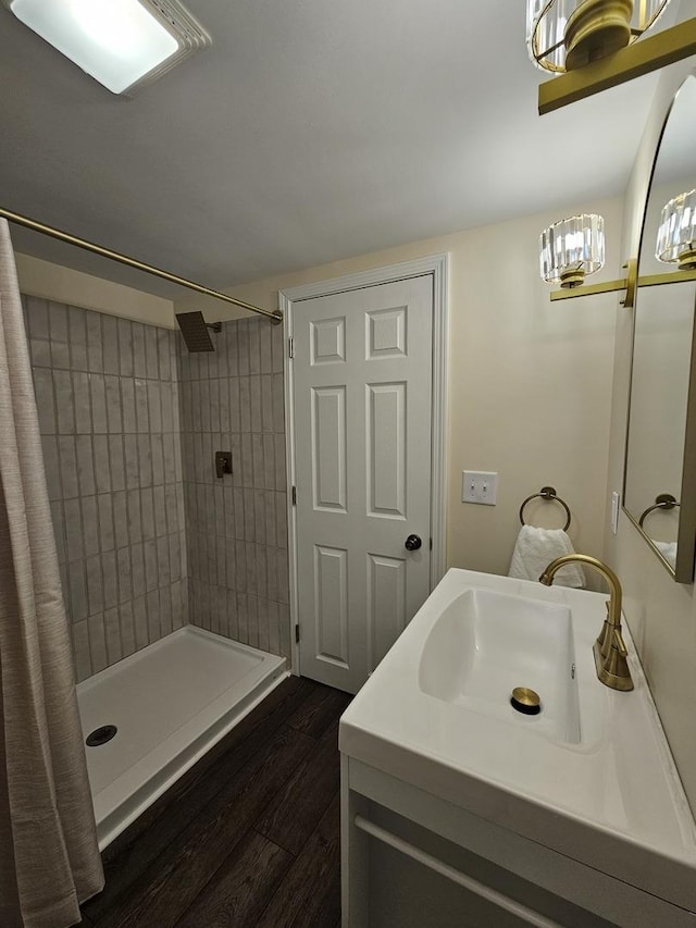 bathroom featuring vanity, hardwood / wood-style floors, and a shower with curtain