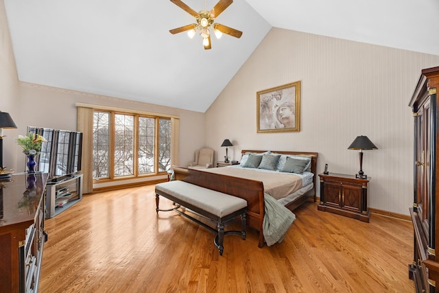 bedroom with ceiling fan, high vaulted ceiling, and light hardwood / wood-style floors