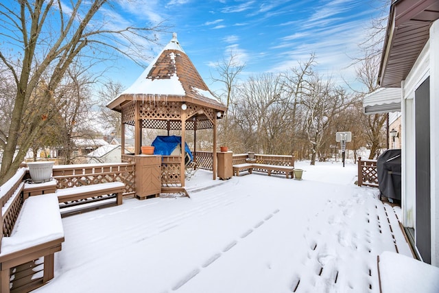 snow covered deck featuring a gazebo and grilling area