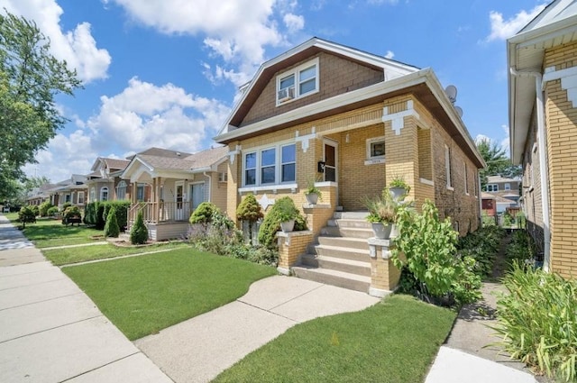 view of front of home featuring a porch and a front yard