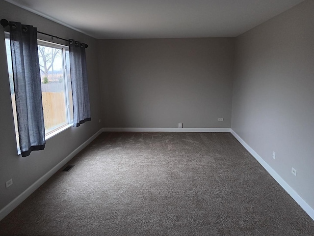 spare room featuring carpet