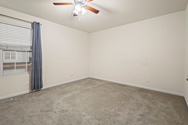 unfurnished room with ceiling fan and carpet flooring