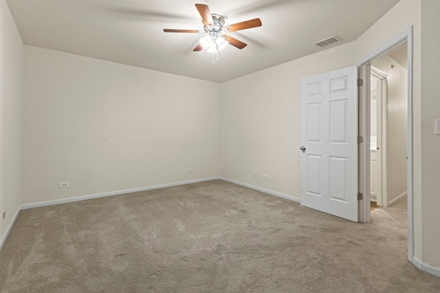 carpeted empty room with ceiling fan