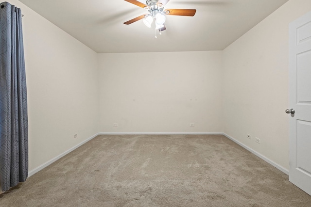 unfurnished room featuring light carpet and ceiling fan