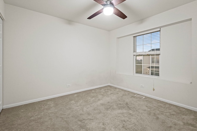 carpeted empty room with ceiling fan