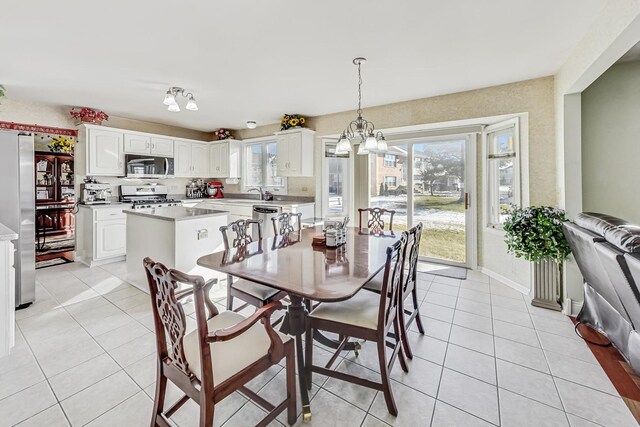 8431 Nielsen Dr, Tinley Park, IL 60487 - tiled dining room featuring sink and a notable chandelier