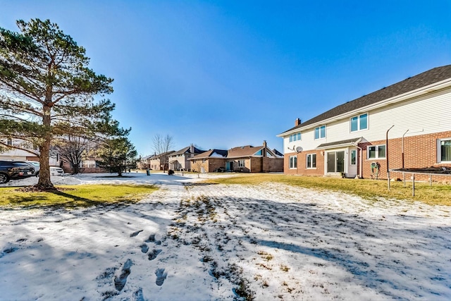 8431 Nielsen Dr, Tinley Park, IL 60487 - yard covered in snow with a trampoline