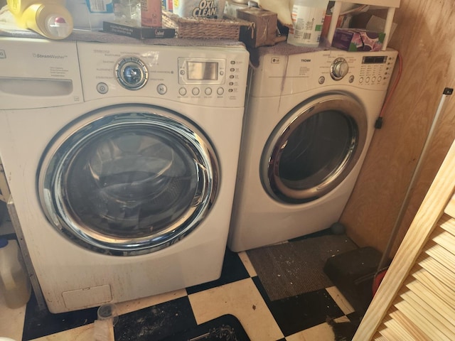 clothes washing area with washing machine and clothes dryer