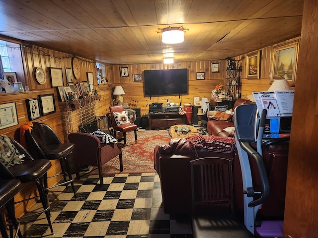 living room featuring wood ceiling and wood walls