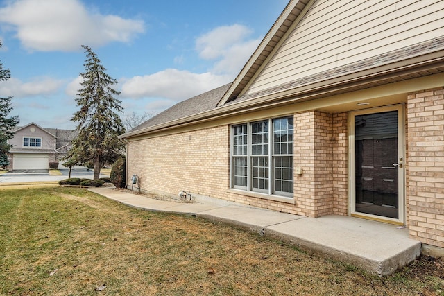 view of home's exterior with a yard