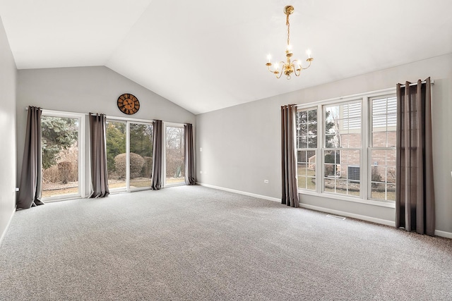 unfurnished living room featuring a healthy amount of sunlight, carpet floors, and a notable chandelier