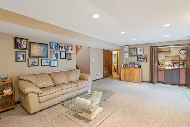 carpeted living room with bar area