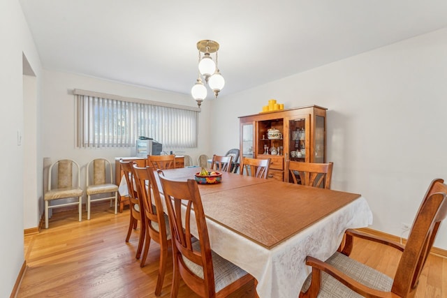 dining space featuring light hardwood / wood-style floors