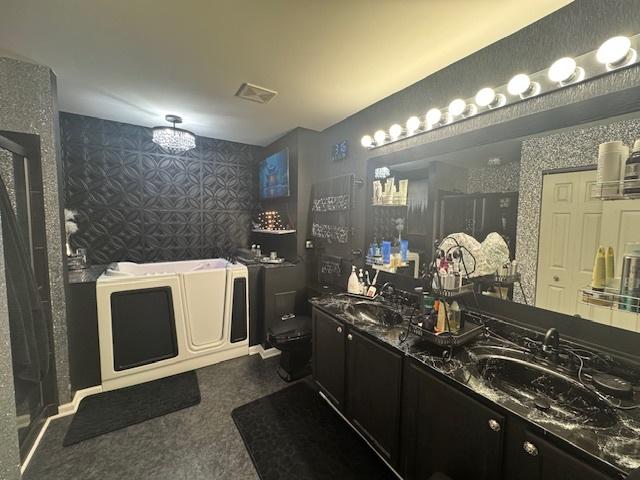 bathroom with vanity and plus walk in shower