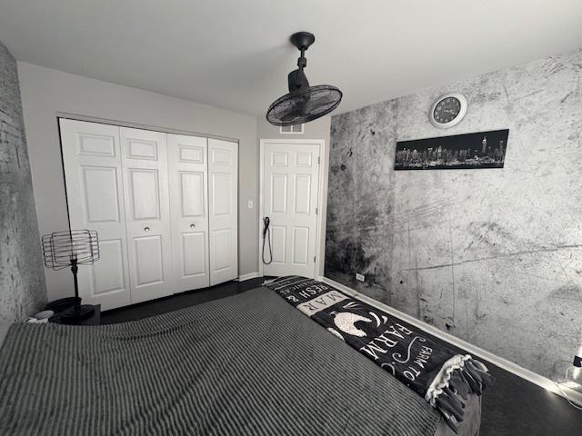 unfurnished bedroom featuring a closet and carpet flooring