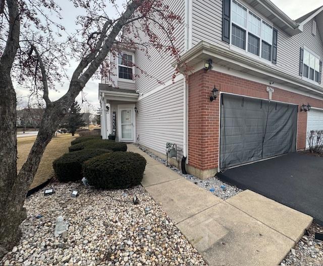 view of side of property with a garage