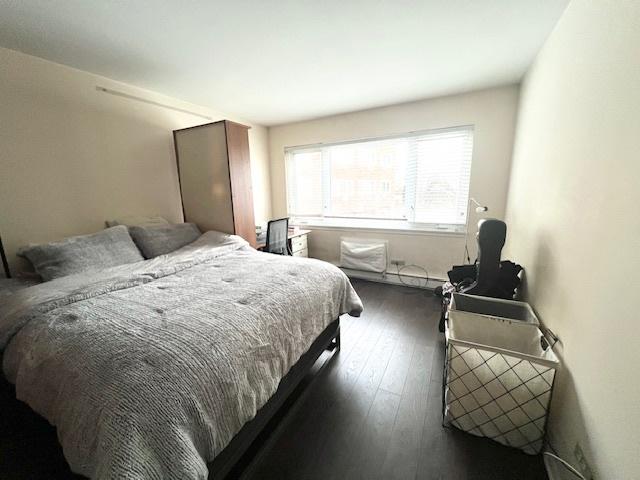 bedroom featuring dark wood-style floors