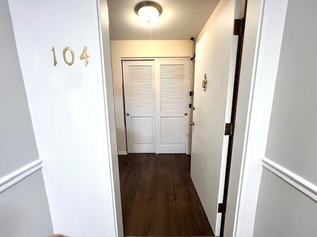 hall featuring dark wood-style flooring