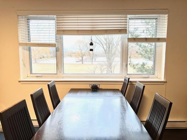 dining space featuring a baseboard heating unit