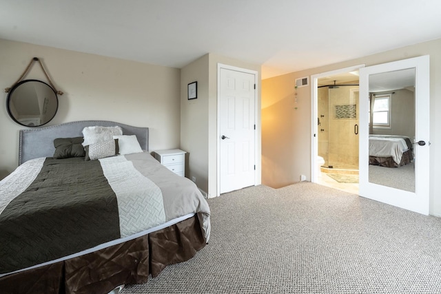 carpeted bedroom with connected bathroom