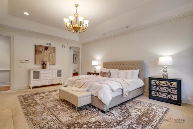 bedroom with crown molding, carpet flooring, an inviting chandelier, and a tray ceiling