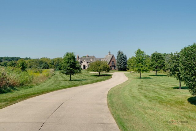 surrounding community featuring a yard