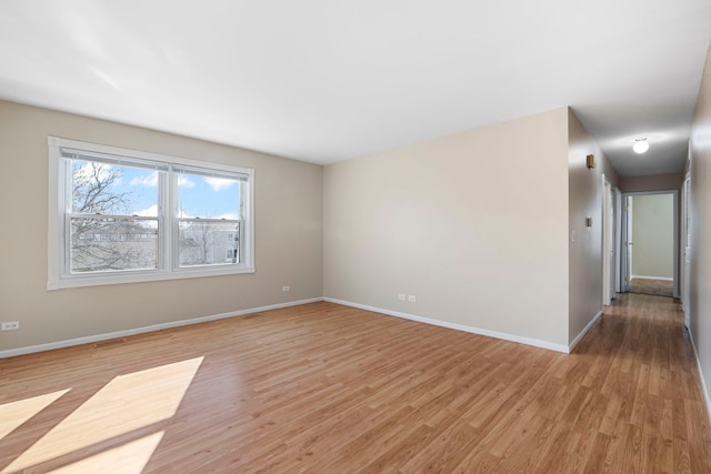 empty room with light hardwood / wood-style floors