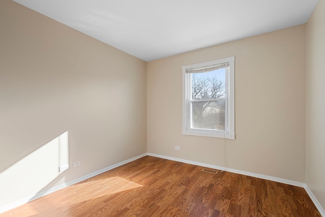 spare room featuring hardwood / wood-style flooring