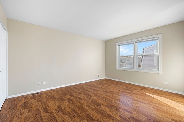 empty room featuring hardwood / wood-style floors