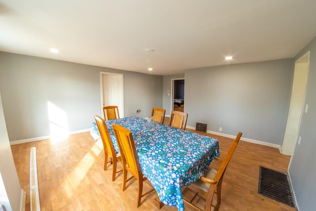 dining space featuring light wood-type flooring