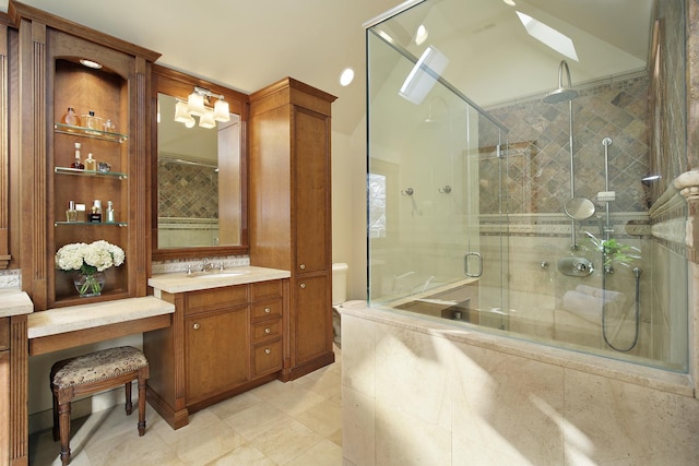 bathroom featuring vanity, a skylight, and a shower with shower door