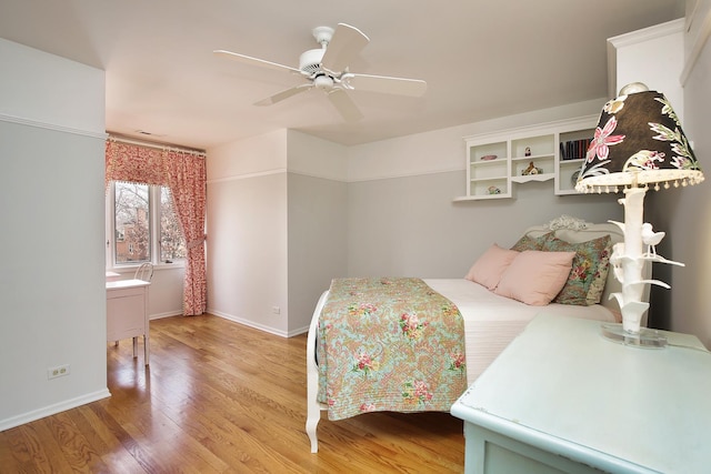 bedroom featuring hardwood / wood-style flooring and ceiling fan