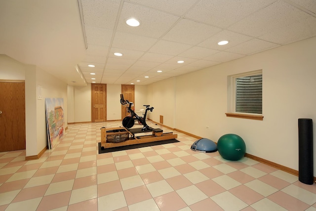 exercise room with a paneled ceiling