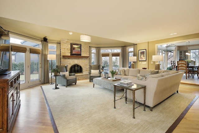 living room with a fireplace and light hardwood / wood-style flooring