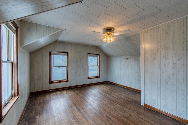 bonus room with ceiling fan, dark hardwood / wood-style floors, and vaulted ceiling