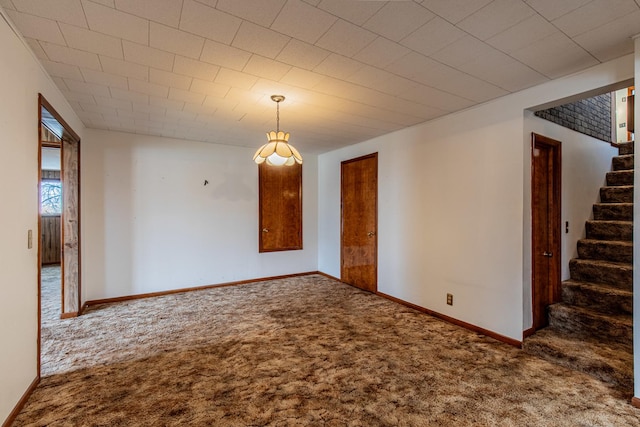 empty room featuring carpet flooring