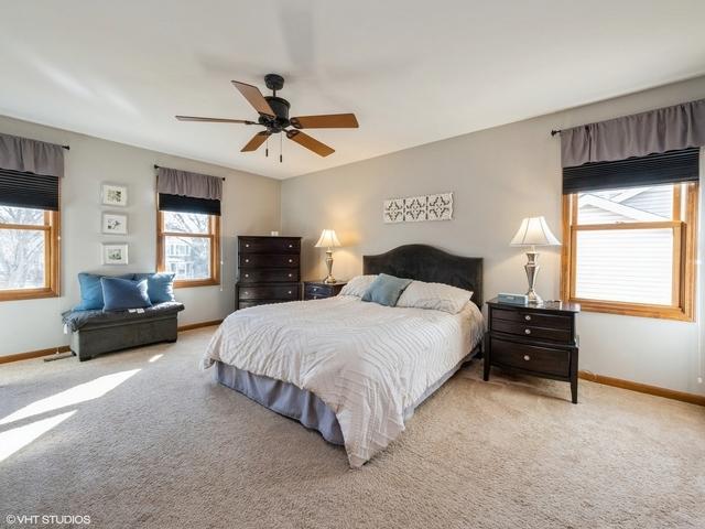 carpeted bedroom featuring ceiling fan