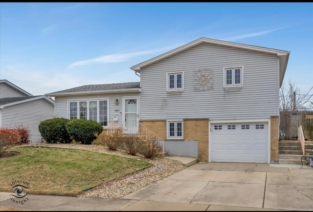 split level home featuring a garage and a front yard