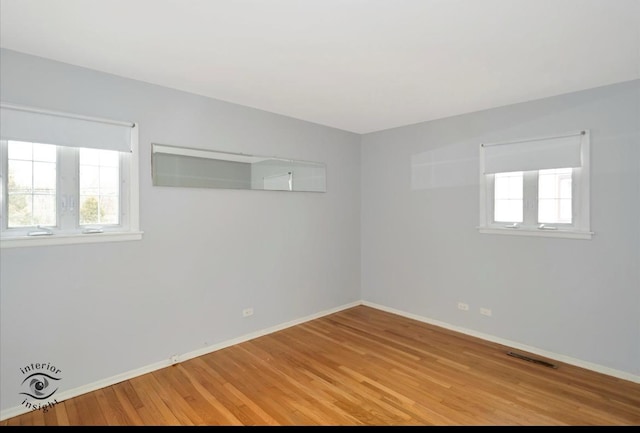 unfurnished room with light hardwood / wood-style floors