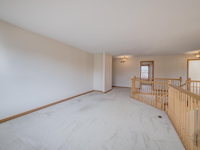 empty room featuring light carpet